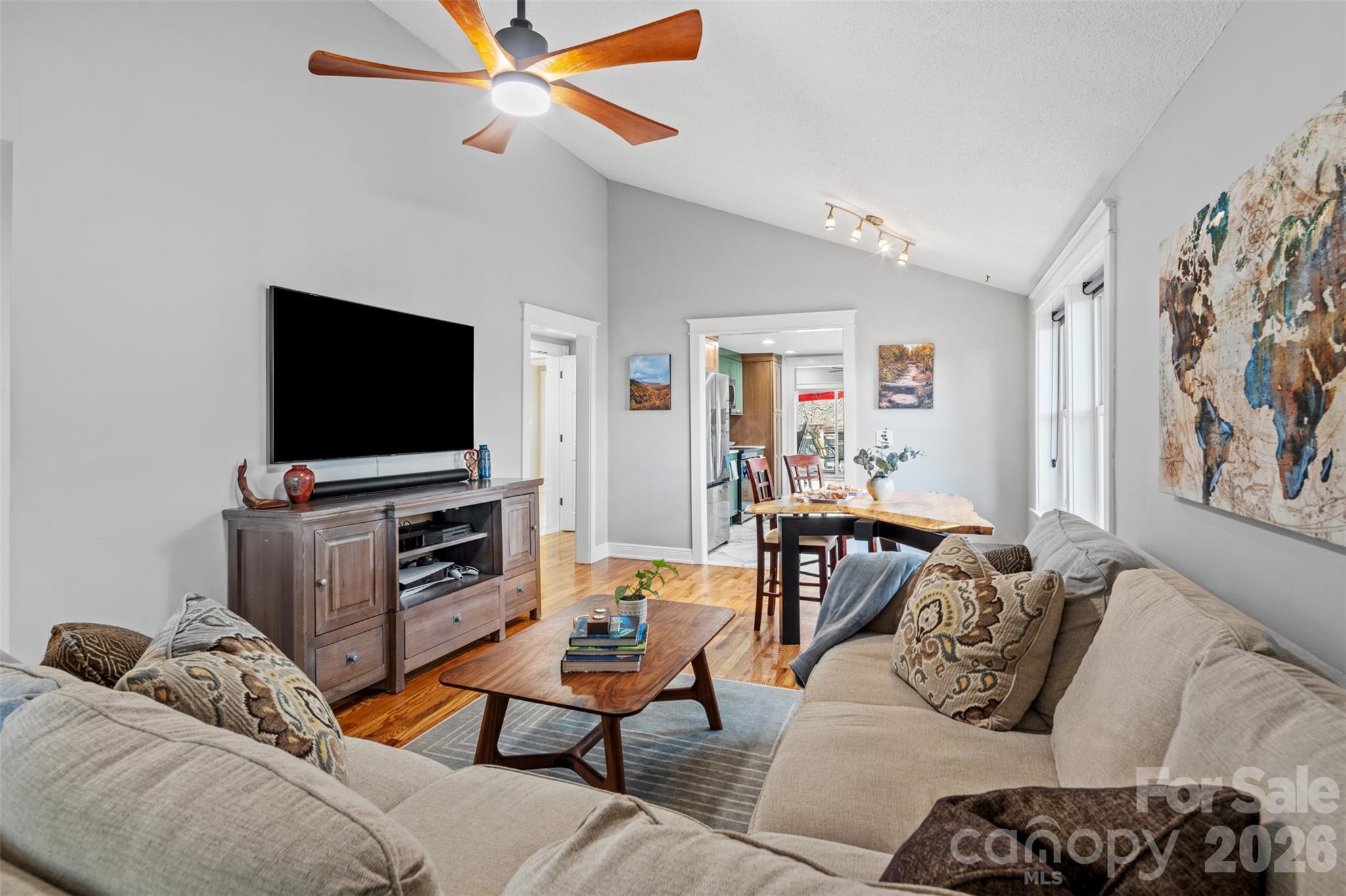 32 Youngs Cove Road Candler, NC 28715 - Photo 7 of 35 a living room with furniture and a flat screen tv