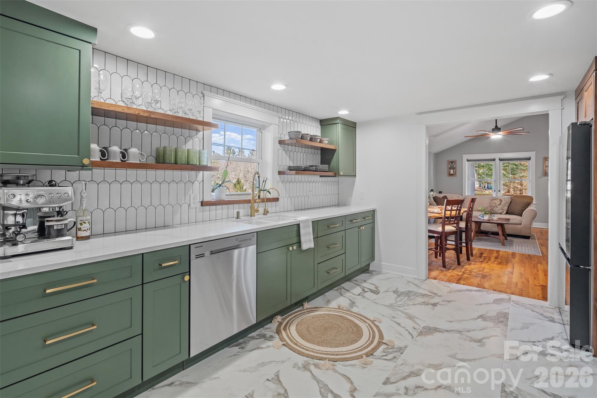 32 Youngs Cove Road Candler, NC 28715 - Photo 10 of 35 a kitchen with sink cabinets and window