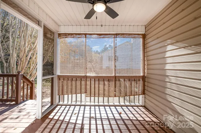 a view of a porch with wooden floor