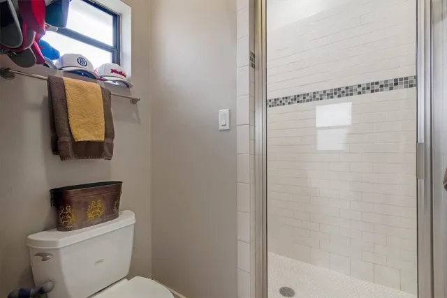 a view of walk in closet with clothes