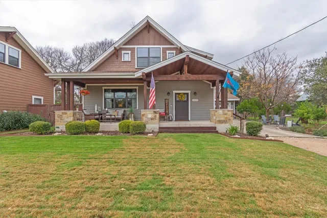 a front view of a house with garden