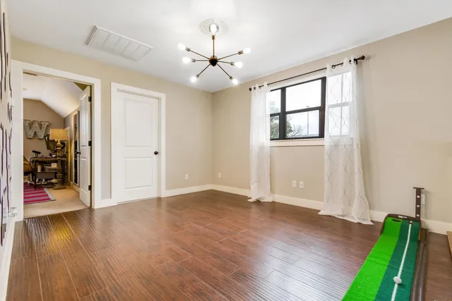 a view of entryway with wooden floor