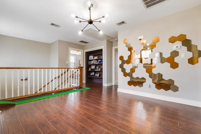 a bathroom with a sink mirror and toilet