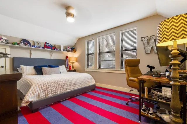 a kitchen with stainless steel appliances kitchen island granite countertop a table and chairs in it