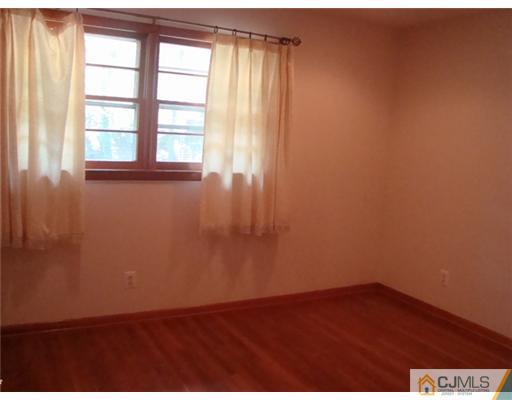 11 Huntington Road Edison, NJ 08820 - Photo 7 of 8 an empty room with a window