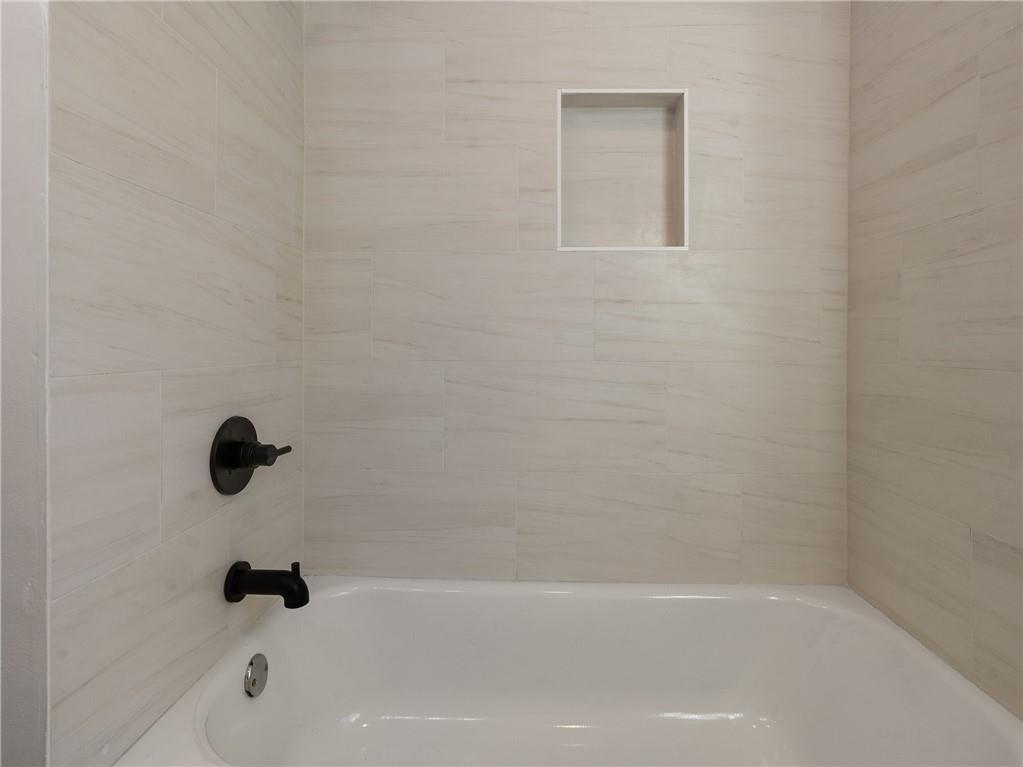 1639 Stokes Avenue Southwest Atlanta, GA 30310 - Photo 33 of 56 a bathroom with a tub