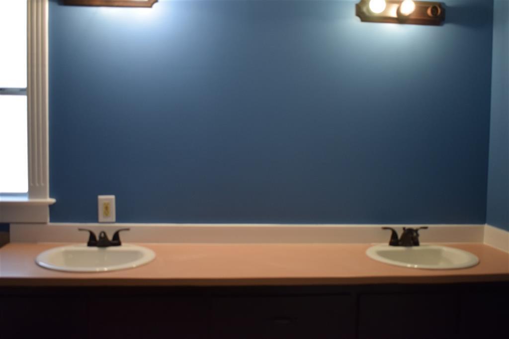 528 Juniper Creek Road Byron, GA 31008 - Photo 12 of 18 a bathroom with a sink and a mirror