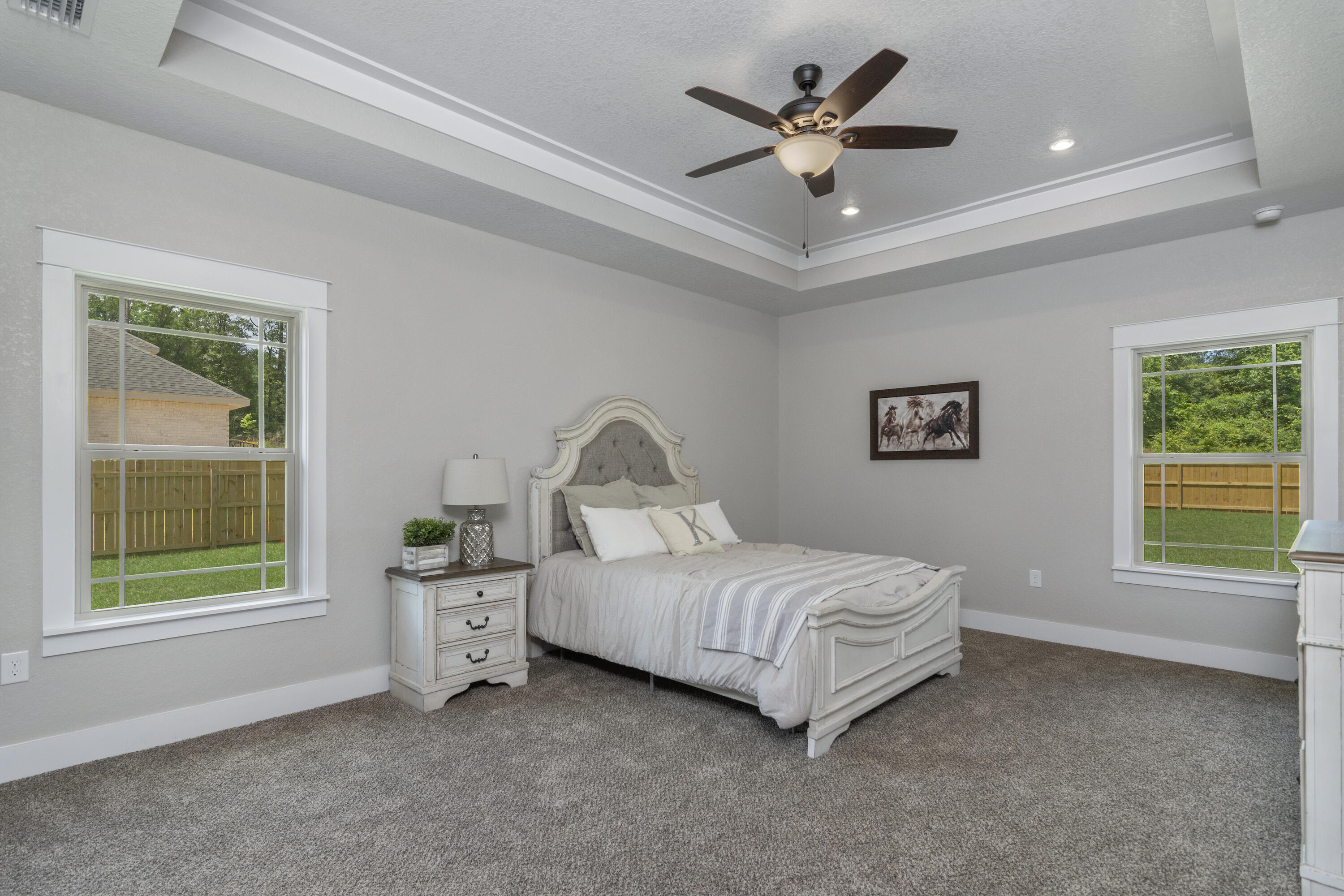 4079 Happy Trails Road Crestview, FL 32539 - Photo 15 of 27 a living room with a bed and a window