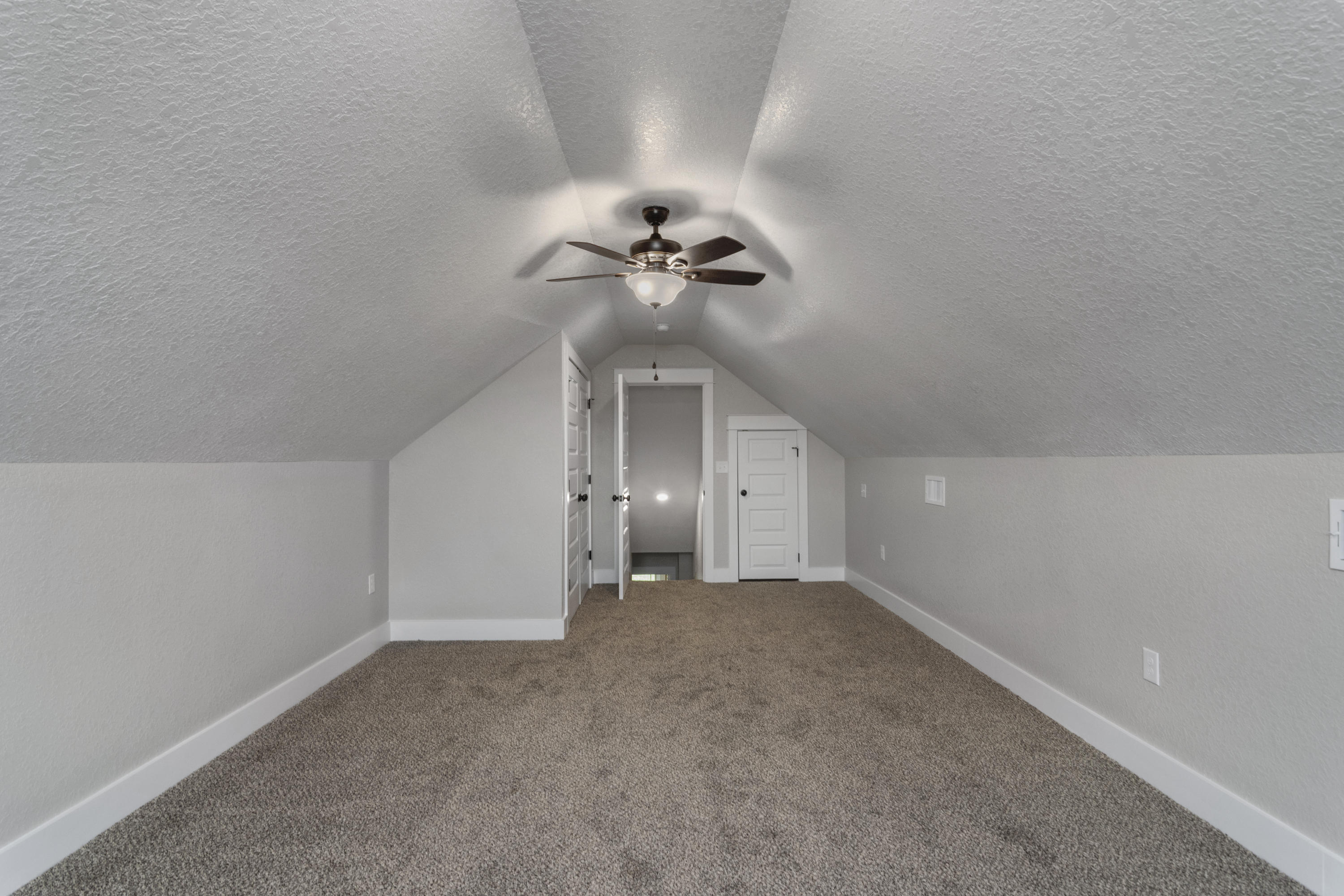 4079 Happy Trails Road Crestview, FL 32539 - Photo 25 of 27 a view of a chandelier fan in an empty room