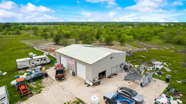 a view of a terrace with a table and chairs