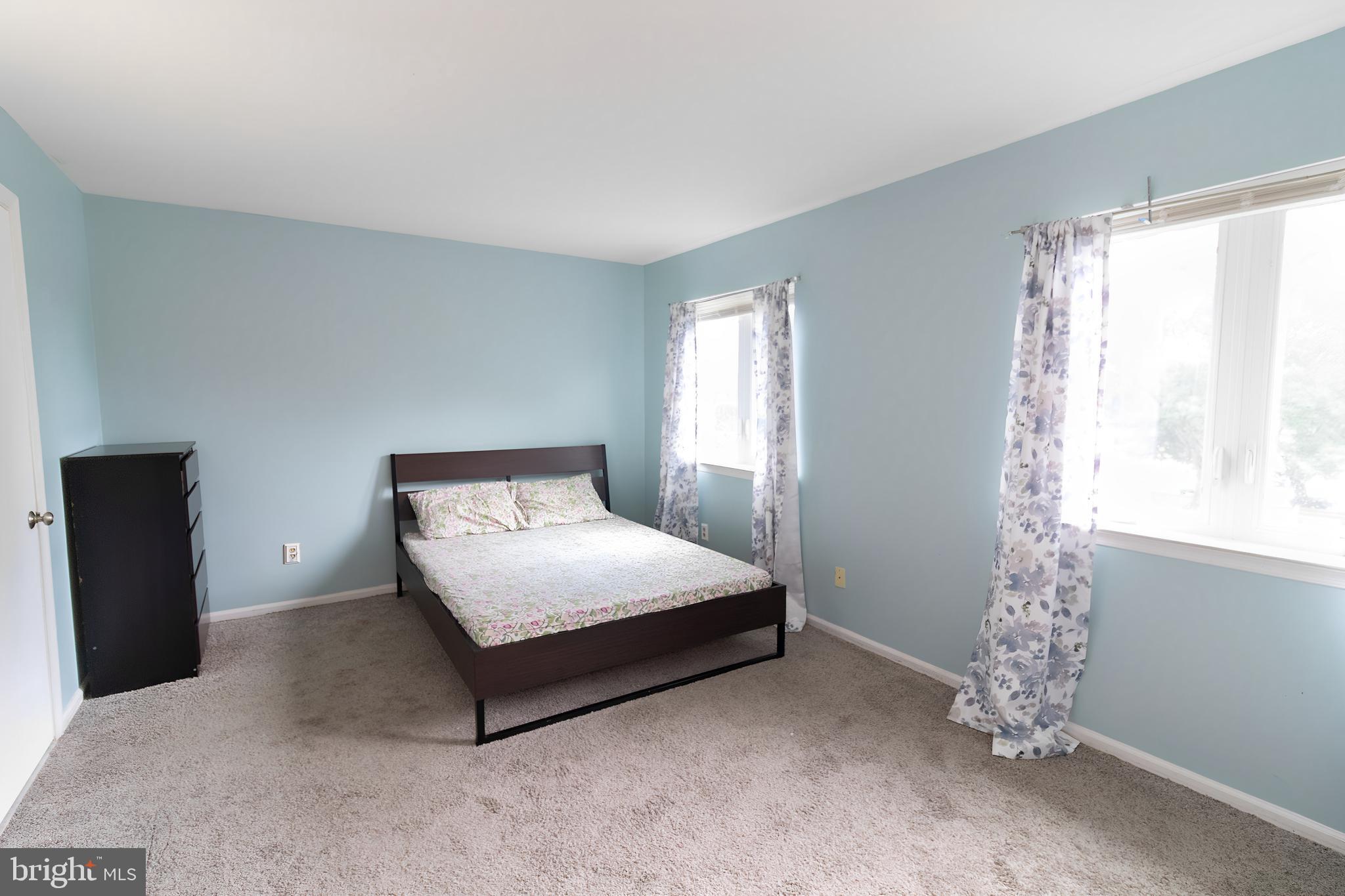 123 Caernarvon Court Exton, PA 19341 - Photo 12 of 26 a bedroom with a bed and a window