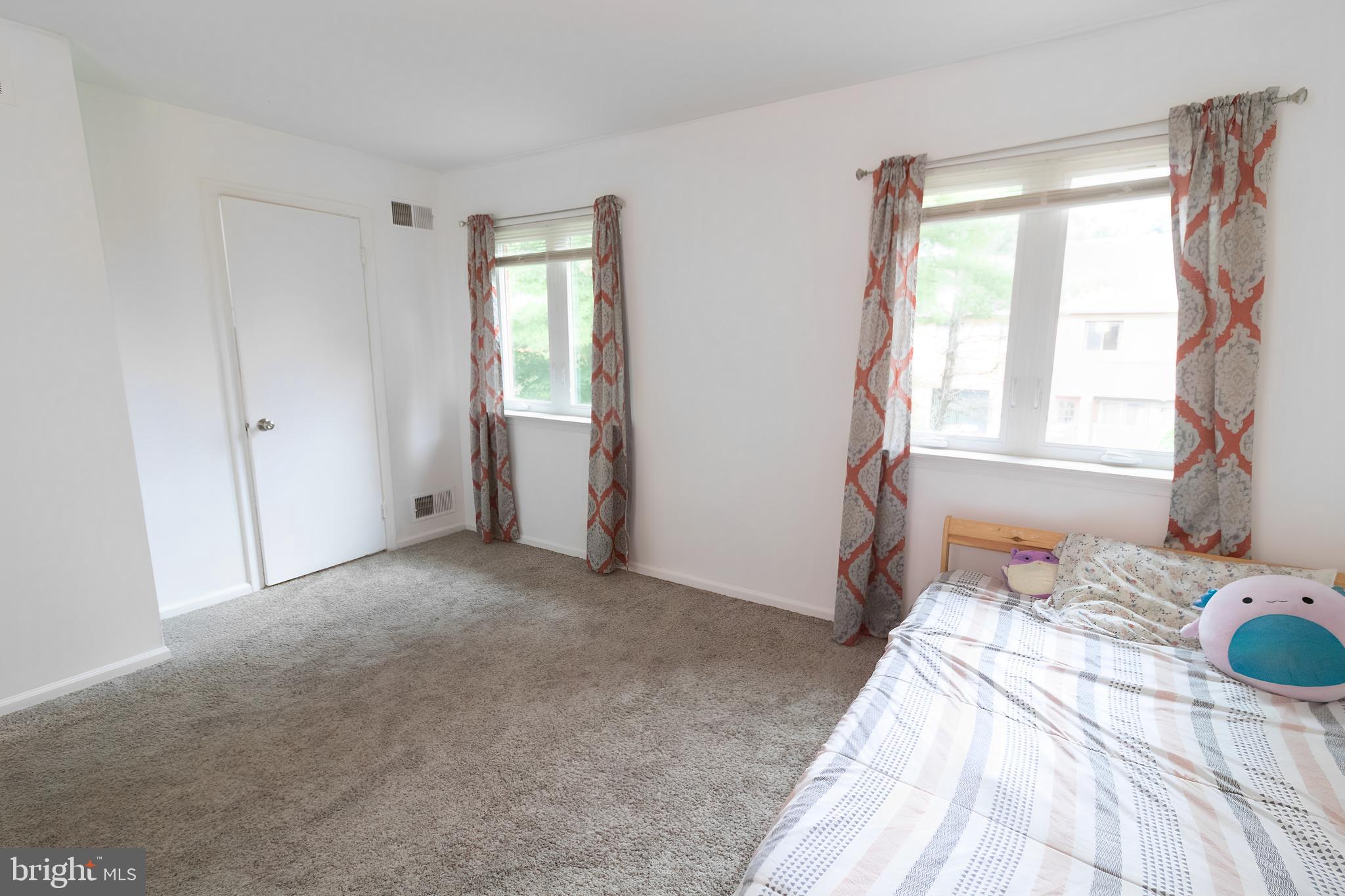 123 Caernarvon Court Exton, PA 19341 - Photo 16 of 26 a bedroom with a bed and a window