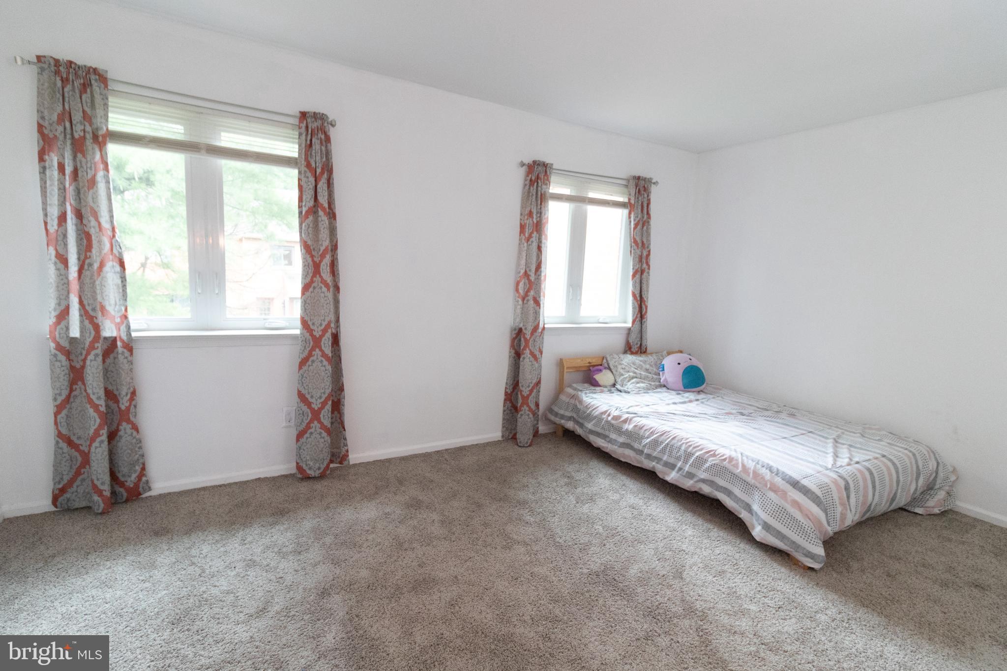 123 Caernarvon Court Exton, PA 19341 - Photo 17 of 26 a room with a bed and a window