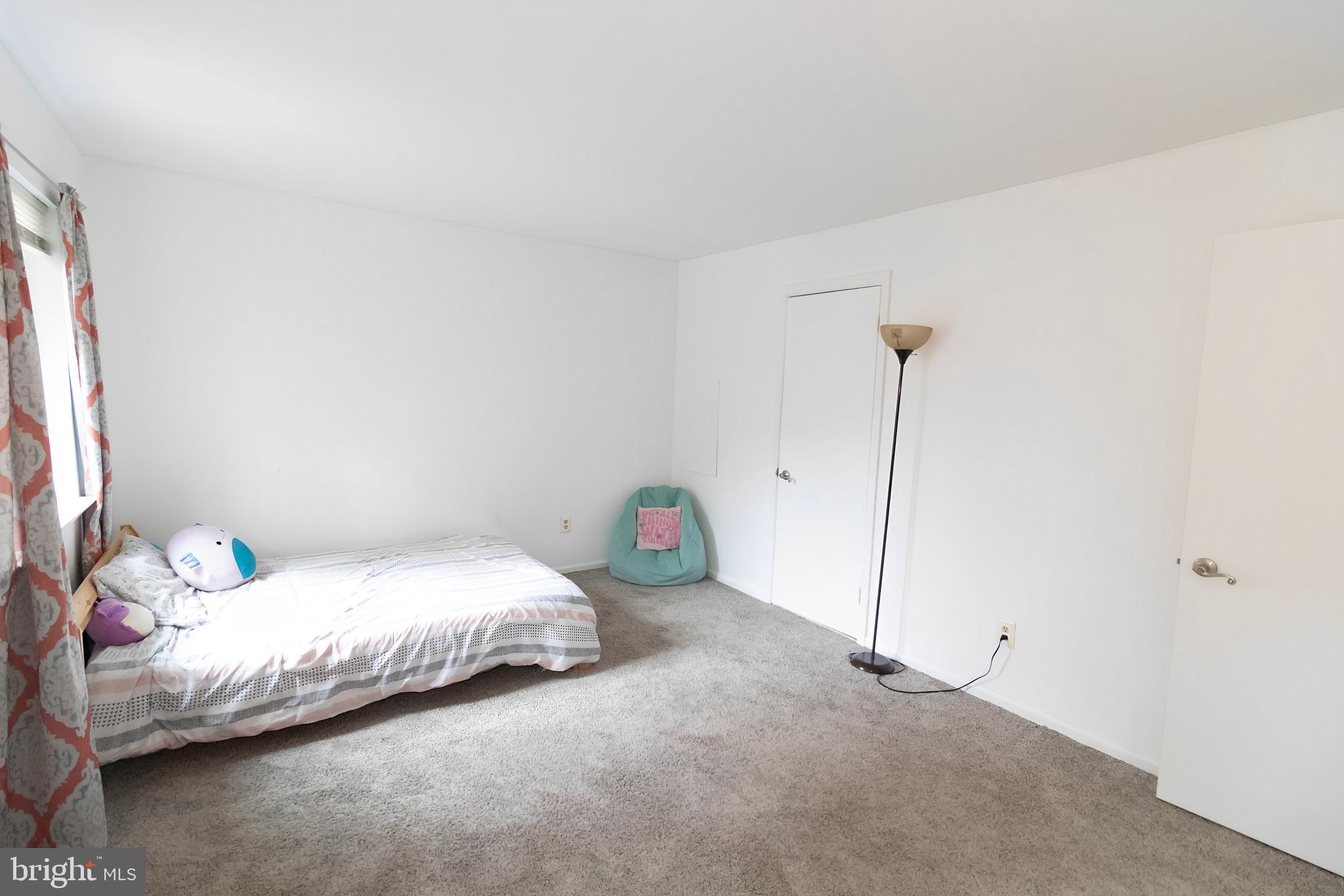 123 Caernarvon Court Exton, PA 19341 - Photo 18 of 26 a bedroom with a bed and a window