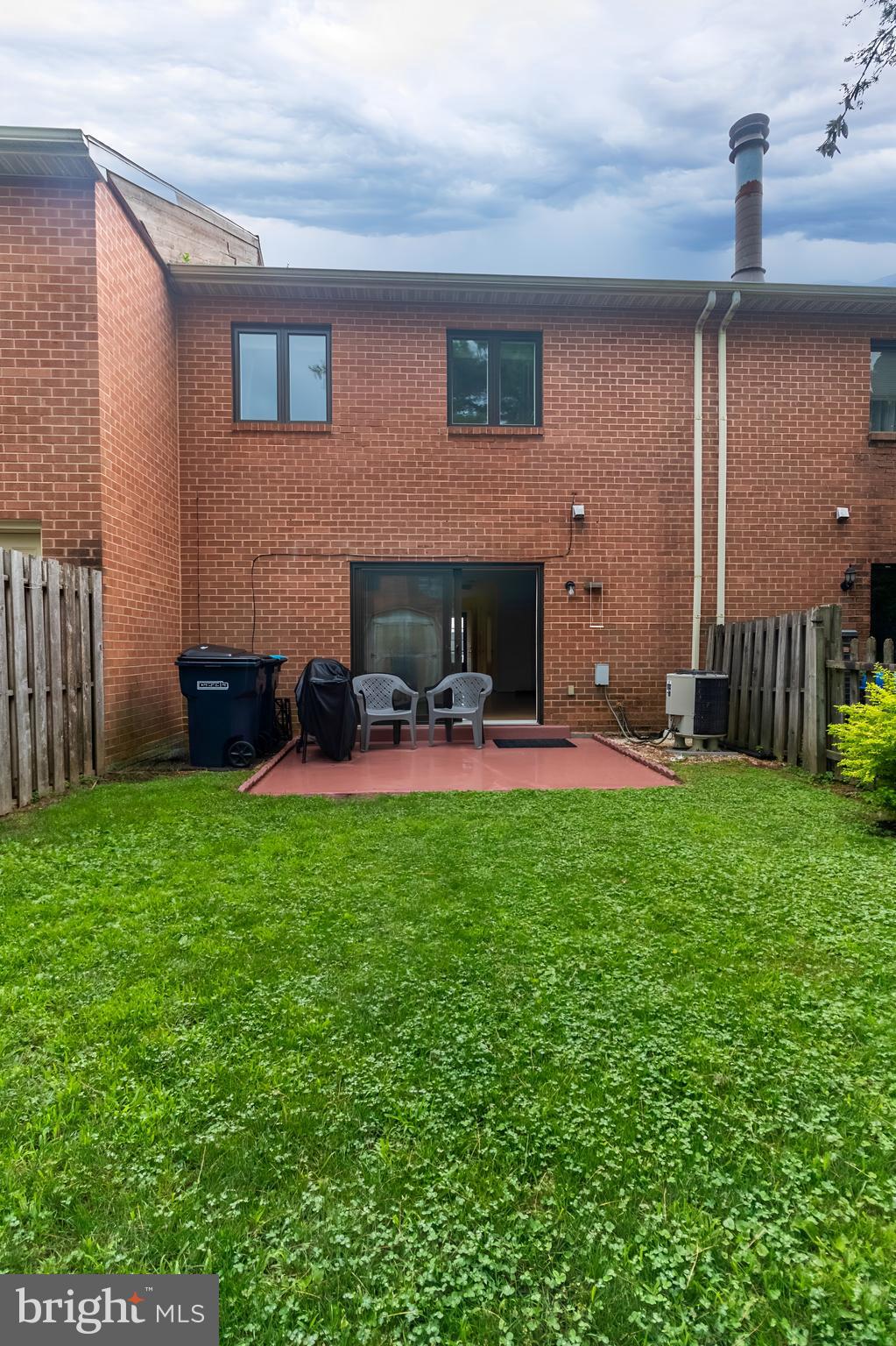 123 Caernarvon Court Exton, PA 19341 - Photo 23 of 26 a backyard of a house with table and chairs