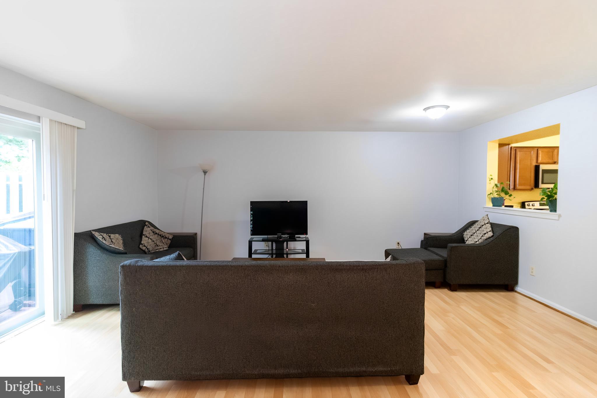 123 Caernarvon Court Exton, PA 19341 - Photo 5 of 26 a living room with furniture and a flat screen tv
