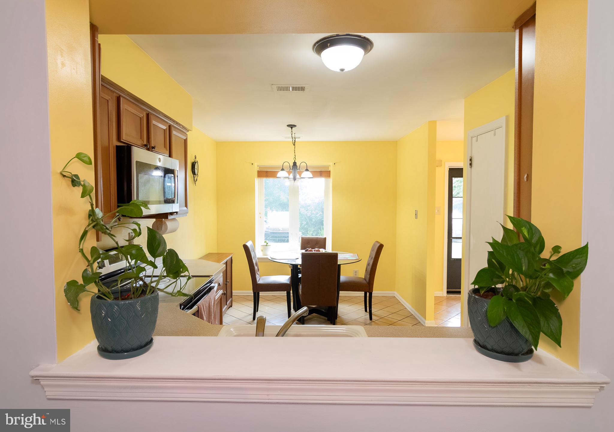 123 Caernarvon Court Exton, PA 19341 - Photo 7 of 26 a view of a dining room with furniture and a potted plant