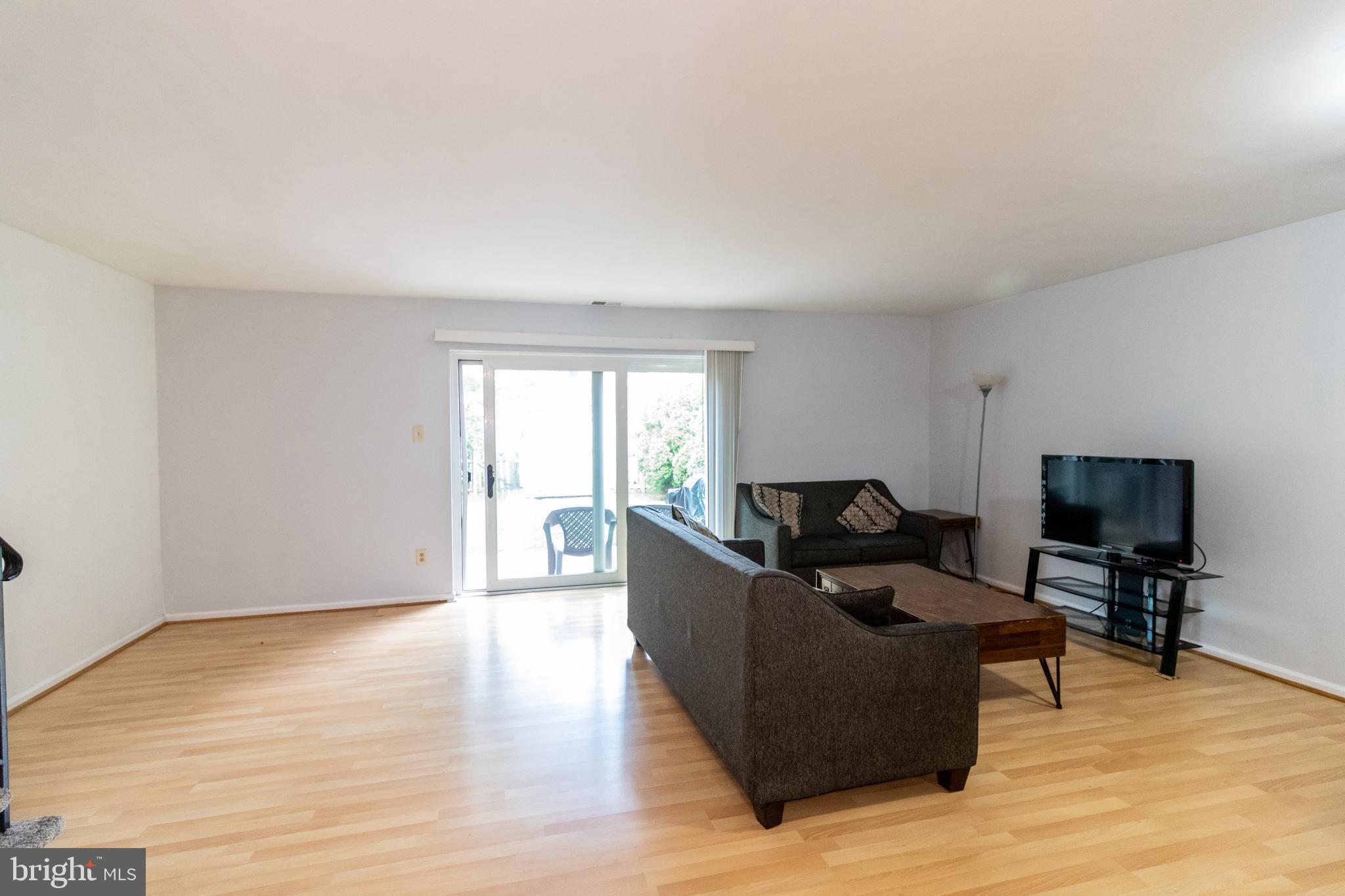 123 Caernarvon Court Exton, PA 19341 - Photo 8 of 26 a living room with furniture and a flat screen tv