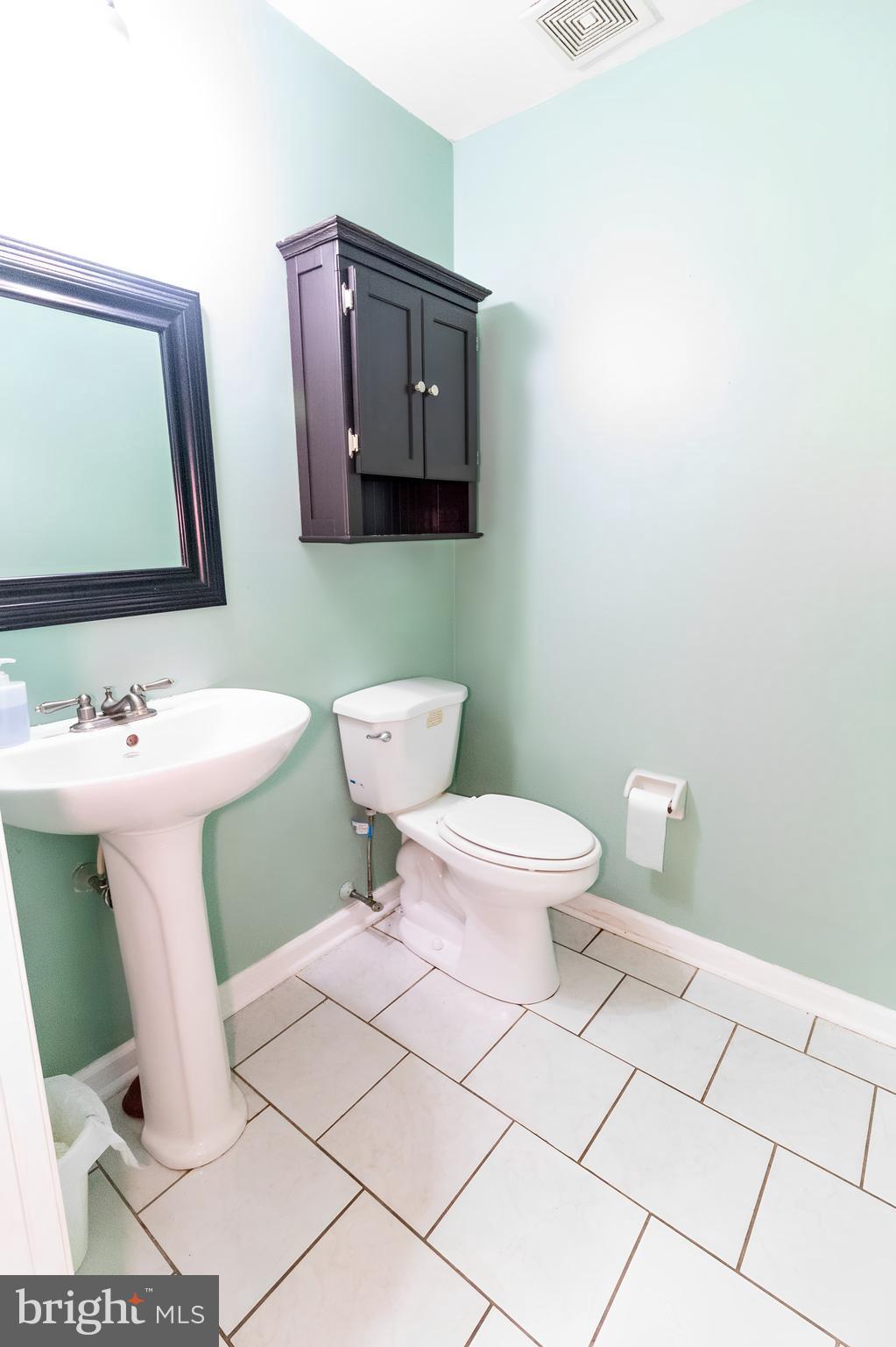 123 Caernarvon Court Exton, PA 19341 - Photo 10 of 26 a bathroom with a toilet sink and mirror