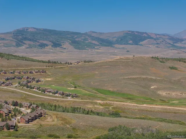 a view of an ocean and a mountain