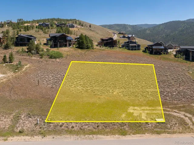 a view of a town with mountains in the background