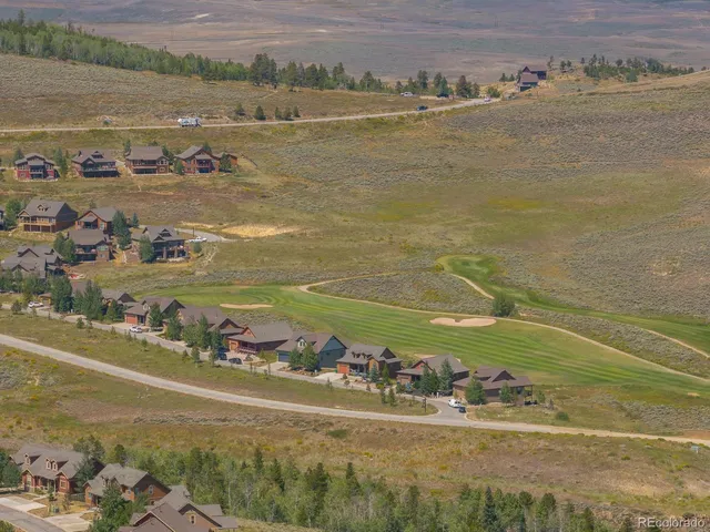 a view of a city with mountains in the background