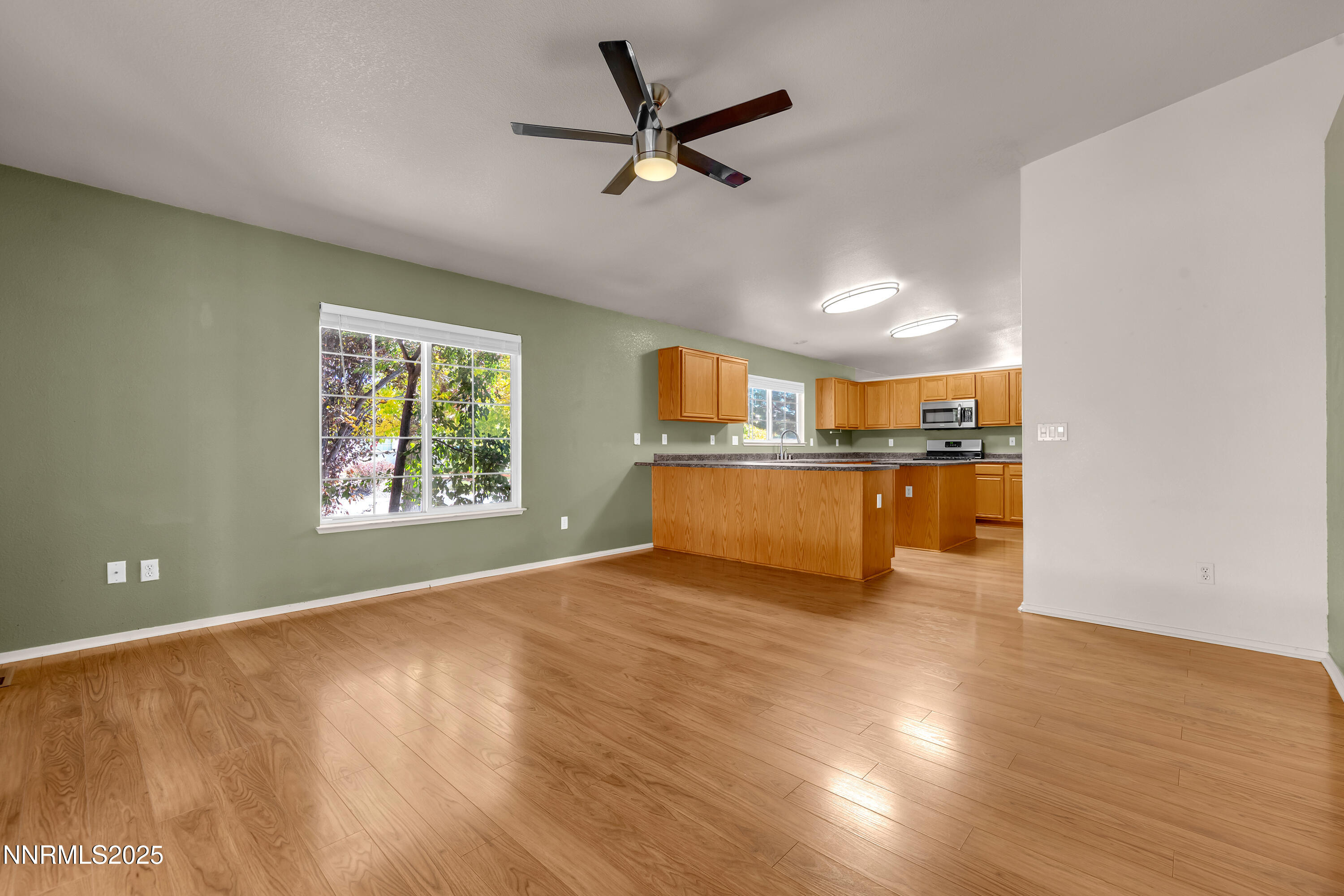 17507 Bear Lake Drive Reno, NV 89508 - Photo 17 of 42 a view of a kitchen with a sink cabinets and wooden floor