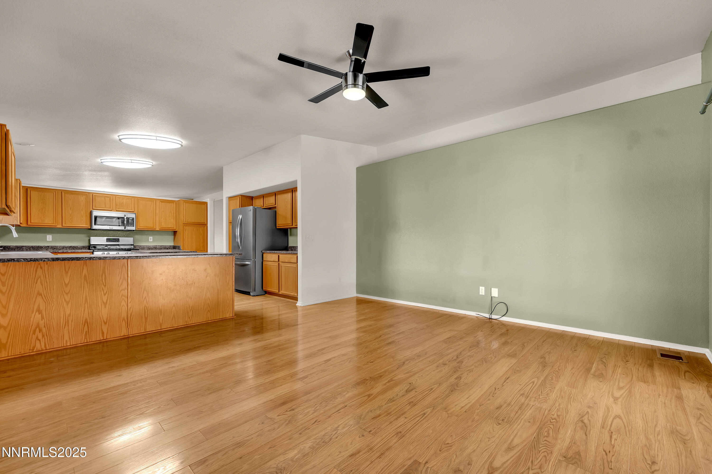 17507 Bear Lake Drive Reno, NV 89508 - Photo 18 of 42 a view of a kitchen with a sink and a refrigerator