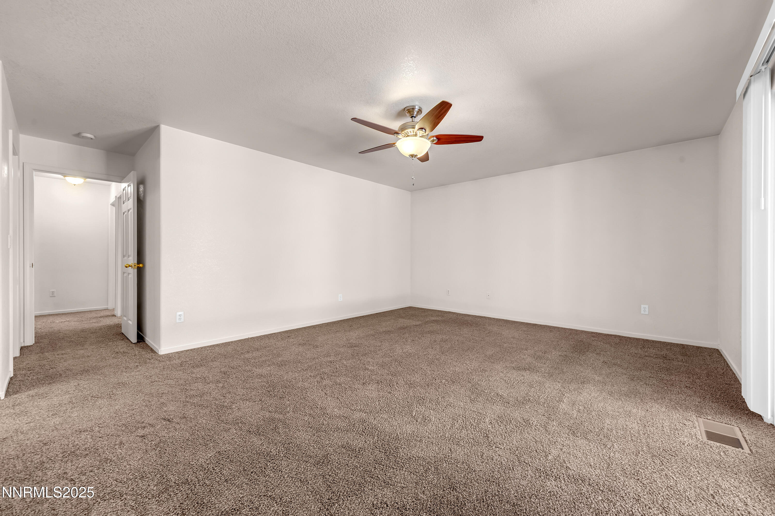 17507 Bear Lake Drive Reno, NV 89508 - Photo 22 of 42 a view of a big room with carpet