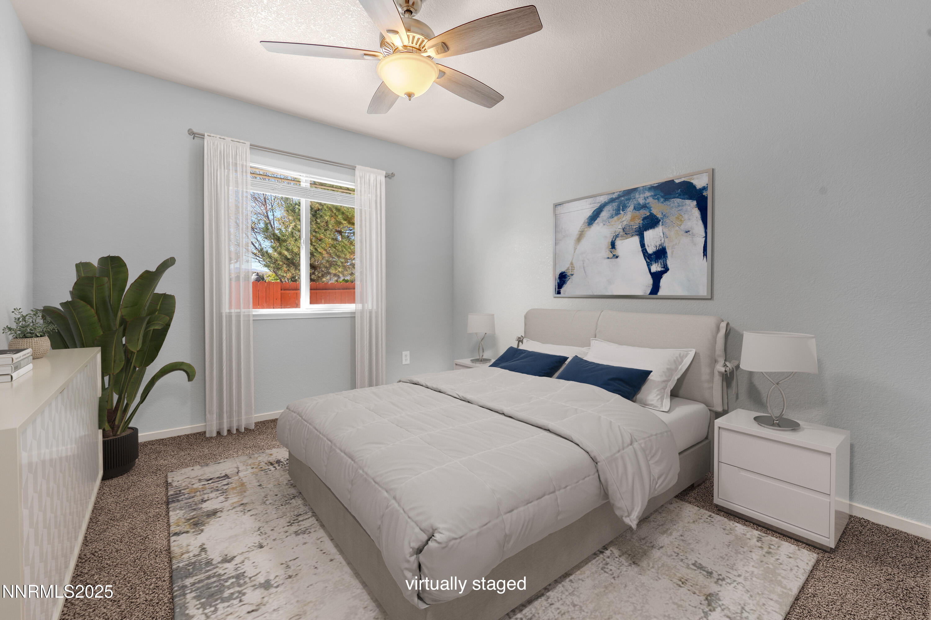 17507 Bear Lake Drive Reno, NV 89508 - Photo 25 of 42 a bedroom with a bed and a chandelier