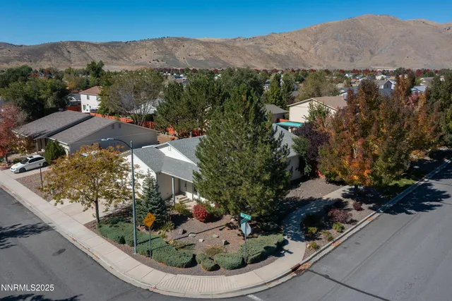 an aerial view of a house with mountain view