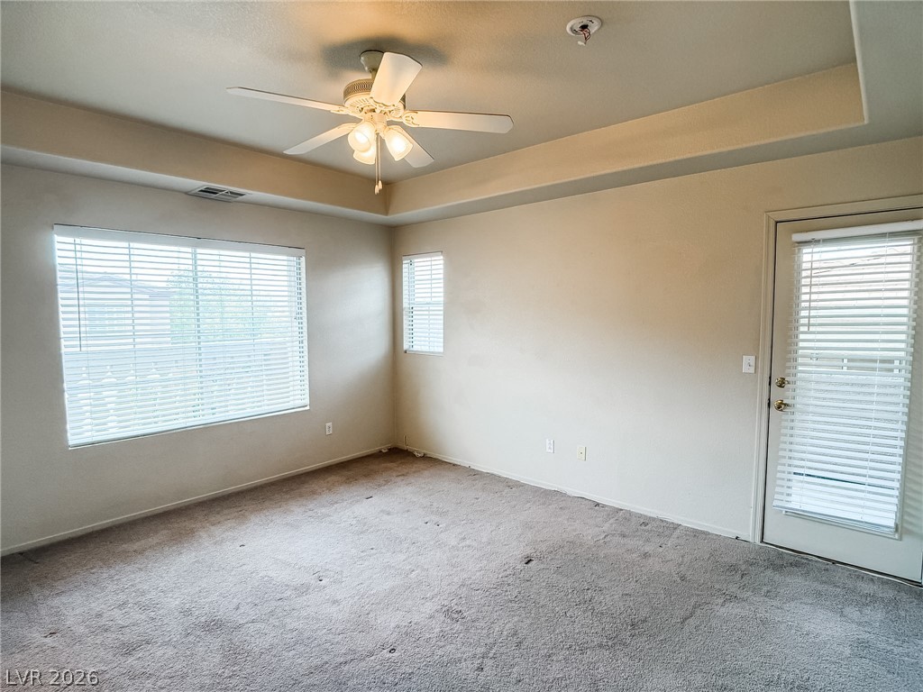 228 Positive Point Street Henderson, NV 89012 - Photo 15 of 27 Well-lit room with plush carpeting and a convenient outdoor access door.