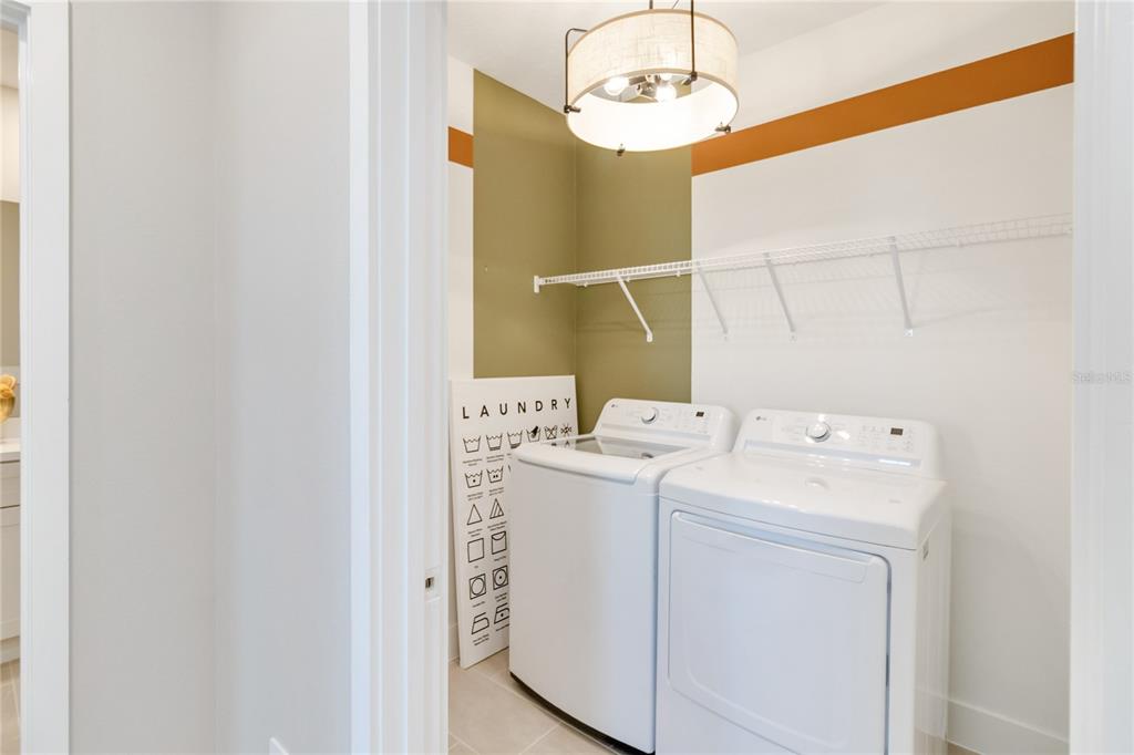1129 Orange Trailside Way Ocoee, FL 34761 - Photo 28 of 32 a utility room with dryer and washer