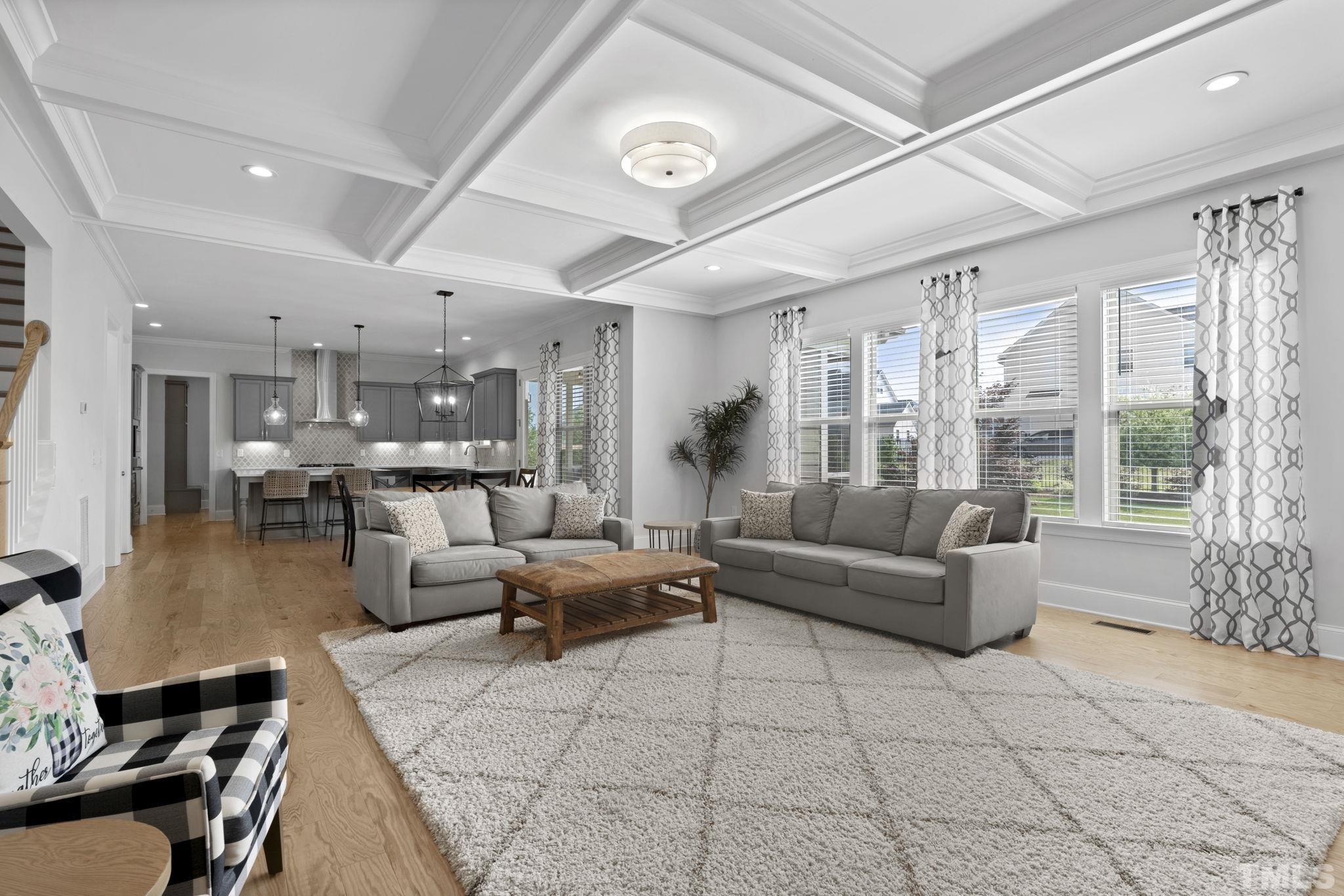 3157 Beechcroft Lane Apex, NC 27502 - Photo 12 of 42 a living room with furniture and a large window
