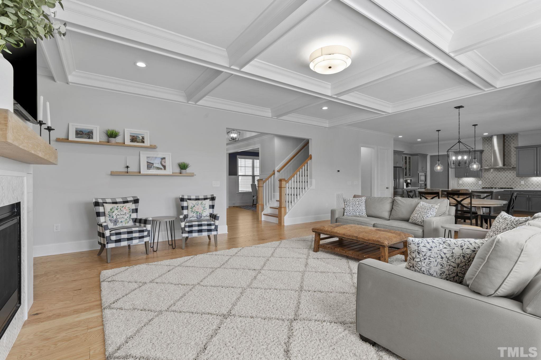 3157 Beechcroft Lane Apex, NC 27502 - Photo 13 of 42 a living room with furniture and a flat screen tv