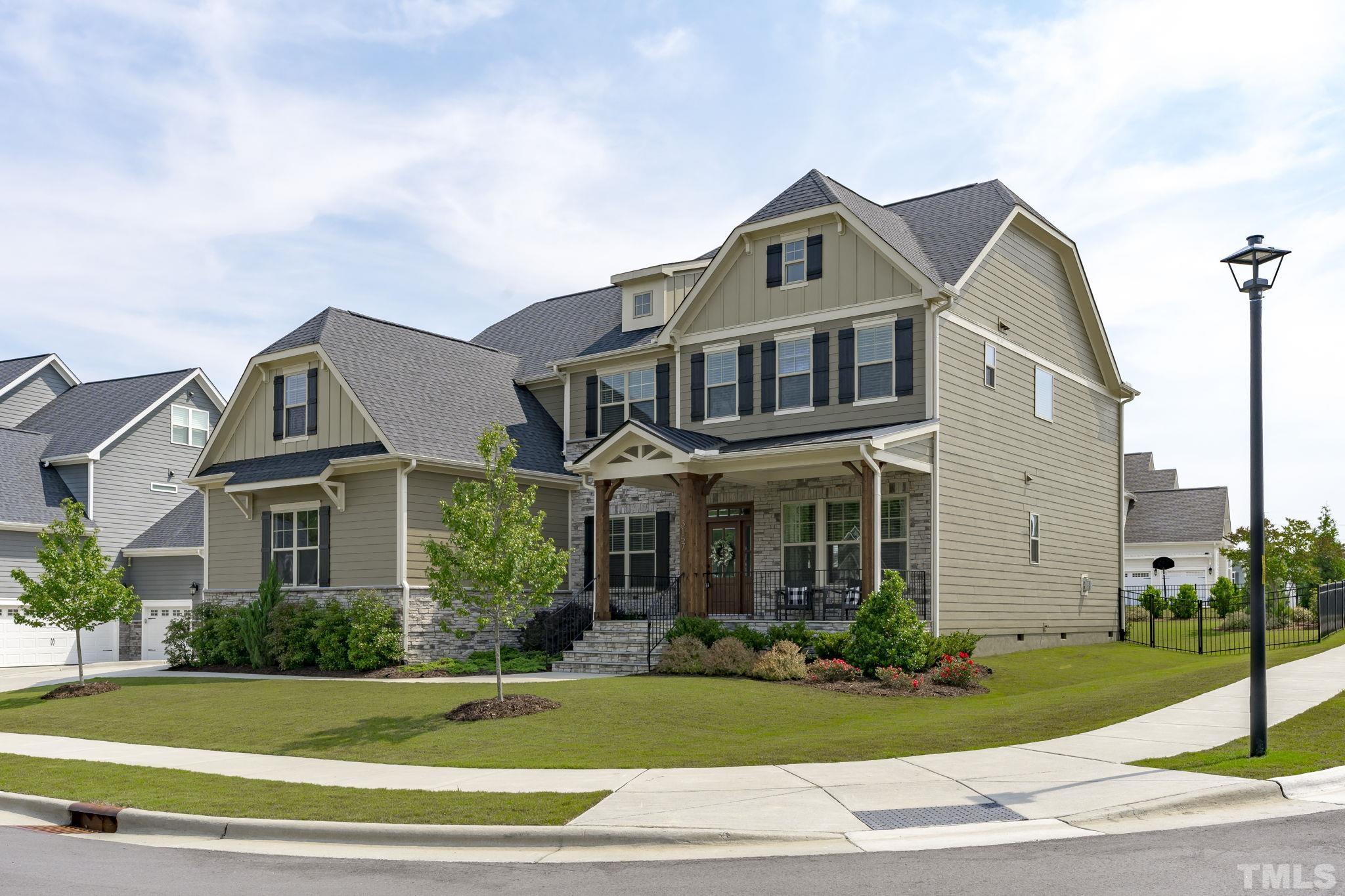 3157 Beechcroft Lane Apex, NC 27502 - Photo 3 of 42 a front view of a house with a yard