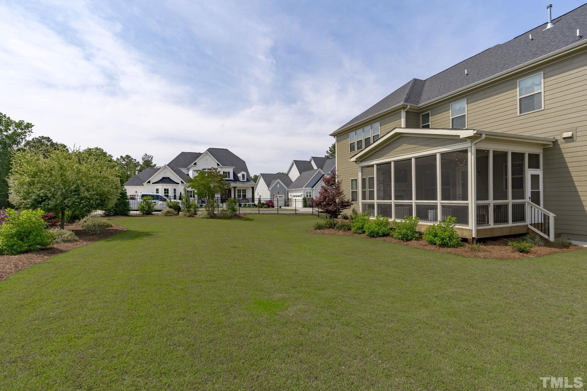 3157 Beechcroft Lane Apex, NC 27502 - Photo 37 of 42 a view of a house with a big yard and large trees