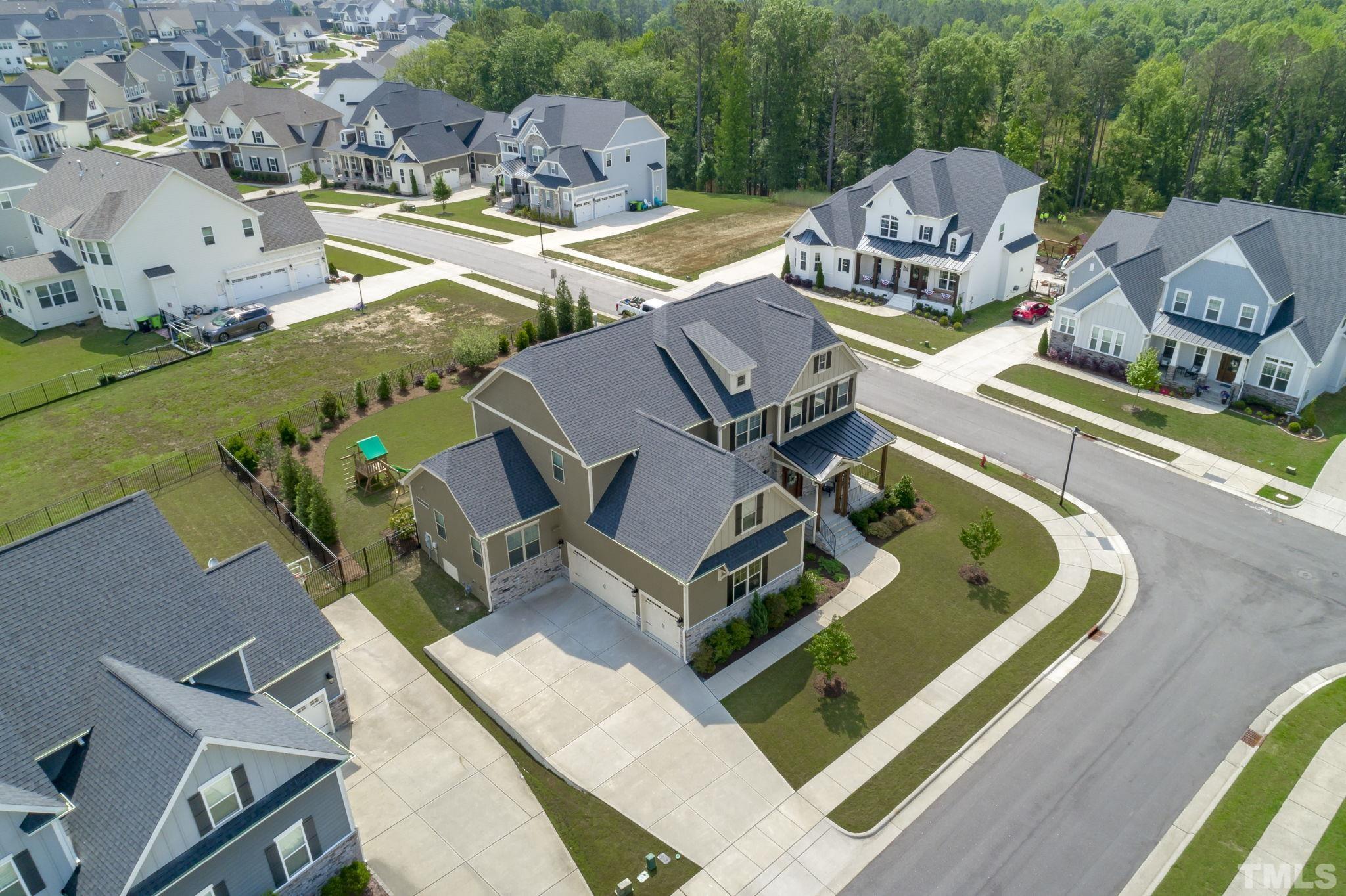 3157 Beechcroft Lane Apex, NC 27502 - Photo 40 of 42 an aerial view of a swimming pool with outdoor seating