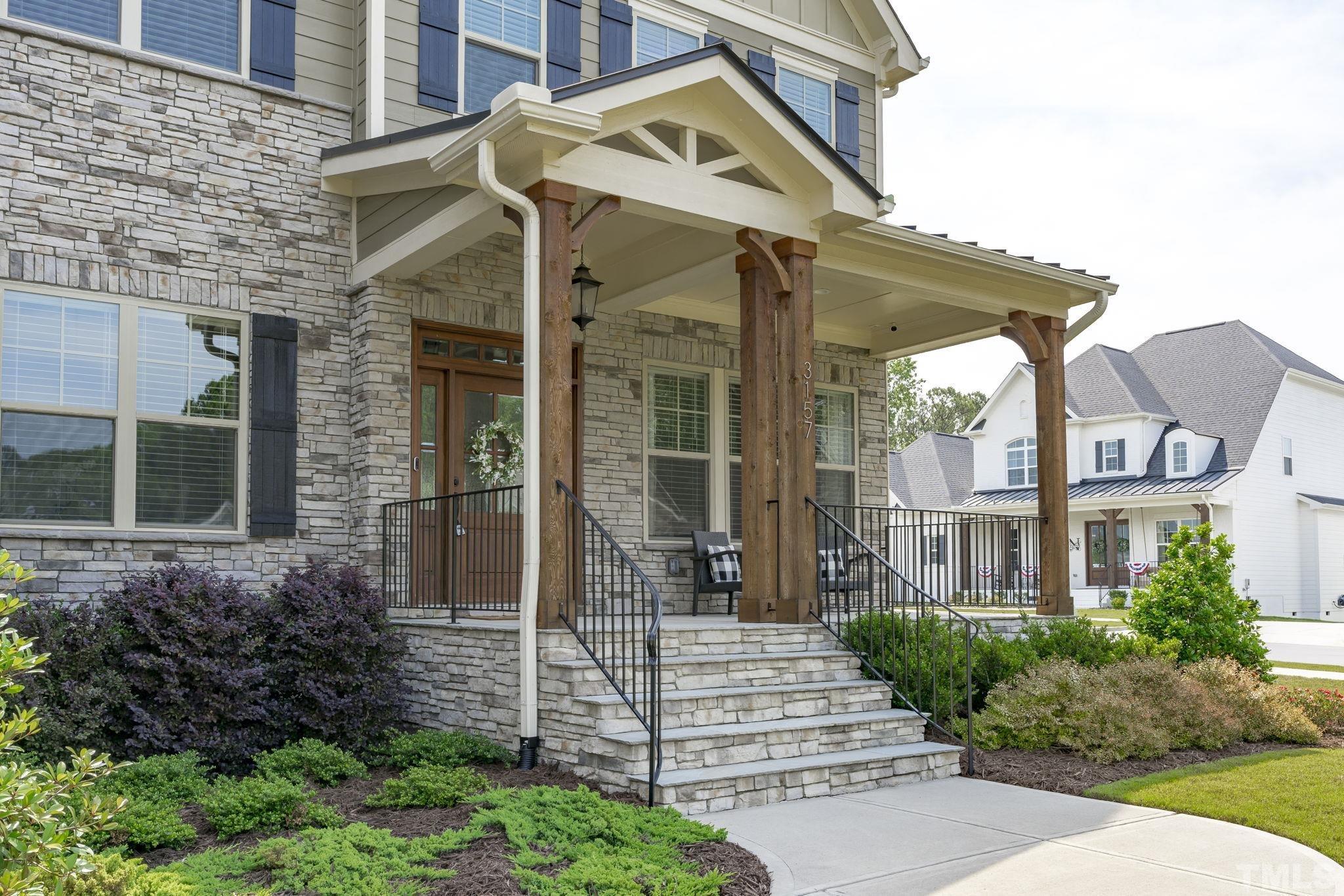 3157 Beechcroft Lane Apex, NC 27502 - Photo 4 of 42 a front view of a house with a garden