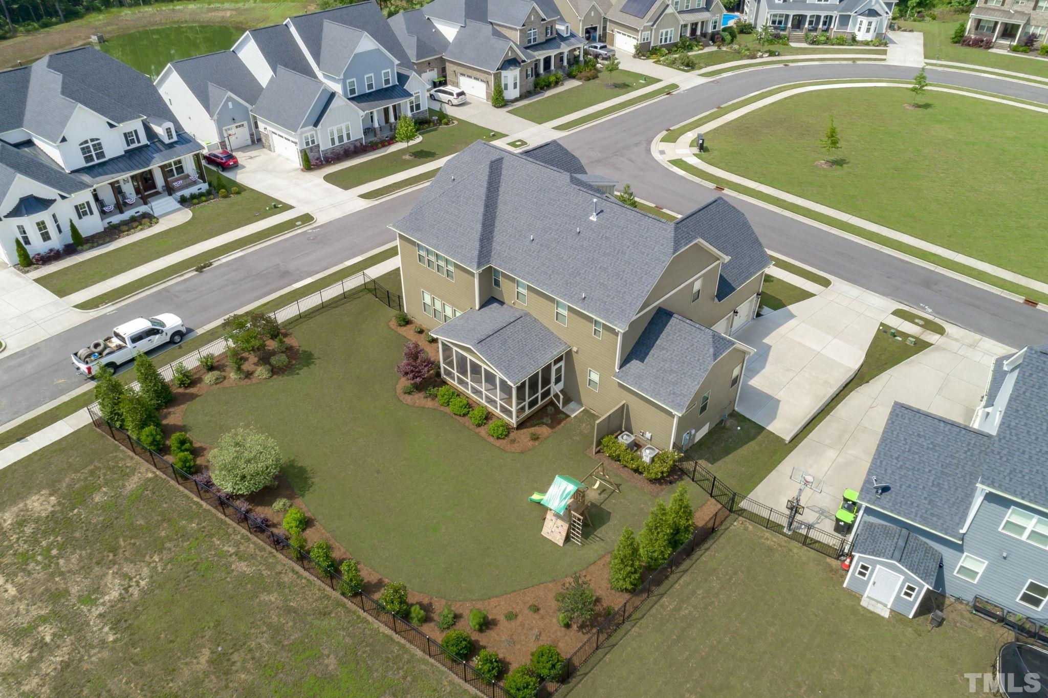3157 Beechcroft Lane Apex, NC 27502 - Photo 41 of 42 an aerial view of a house with a swimming pool