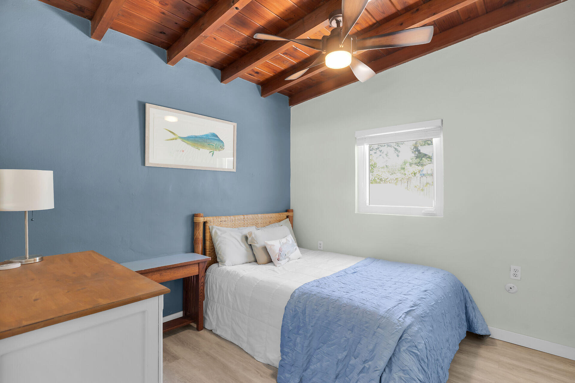 10 Dolphin Road Key Largo, FL 33037 - Photo 23 of 55 a bedroom with a bed and a painting on the wall