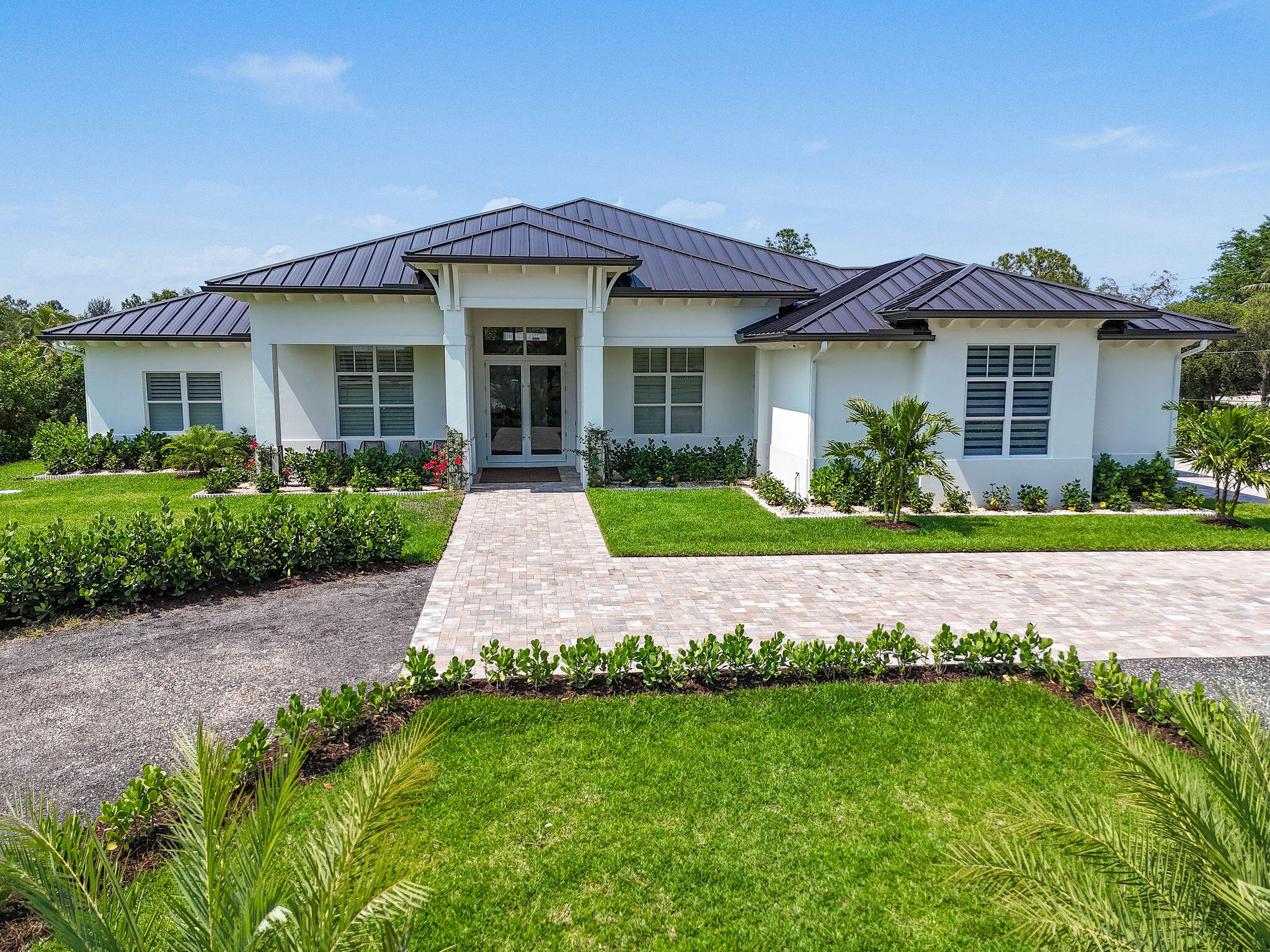 9105 Whippoorwill Trail Jupiter, FL 33478 - Photo 1 of 58 Arrival