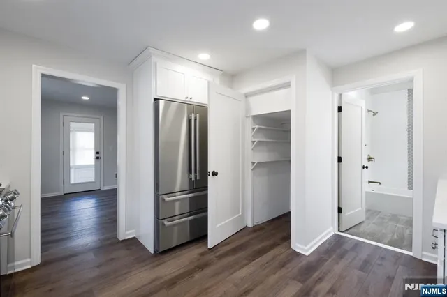 a living room with furniture and a gate