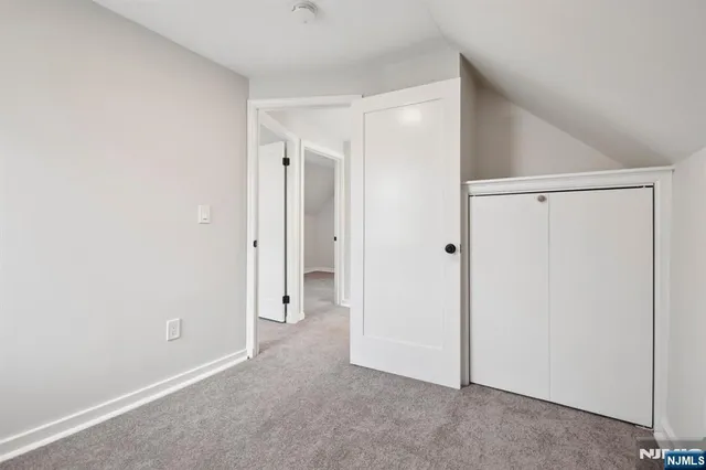 a kitchen with stainless steel appliances a stove microwave and sink