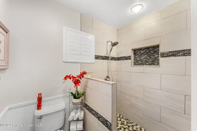 a bathroom with a bathtub and shower