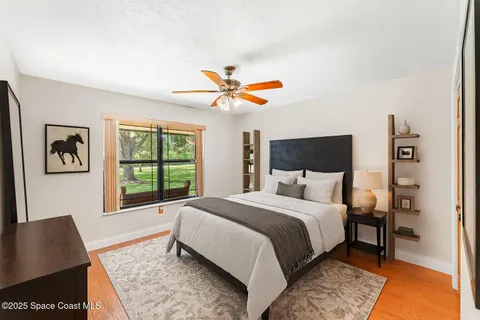 a view of a backyard patio with swimming pool