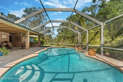 a front view of house with yard garden and trees