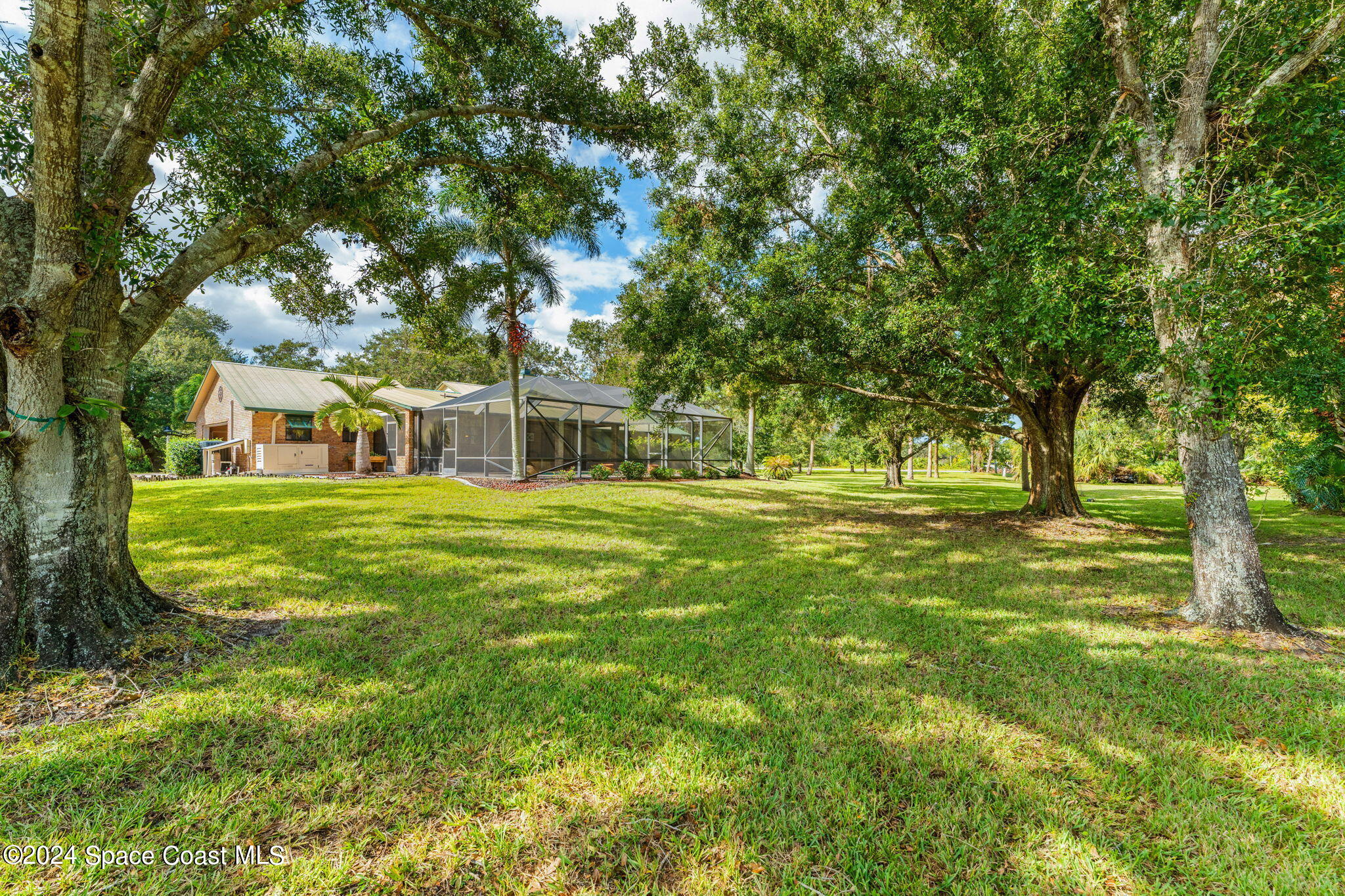 3535 Grant Road Grant-Valkaria, FL 32949 - Photo 21 of 27 a view of white house with a big yard
