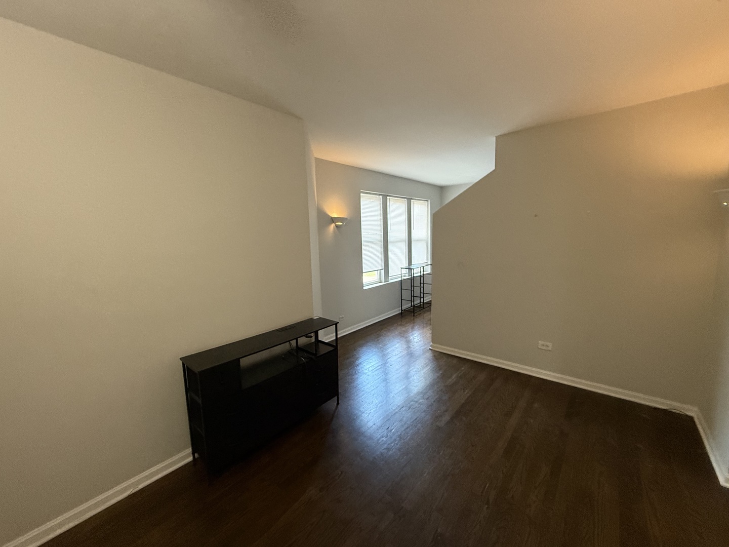 6848 32nd Street, Unit 4 Berwyn, IL 60402 - Photo 5 of 7 an empty room with wooden floor and windows