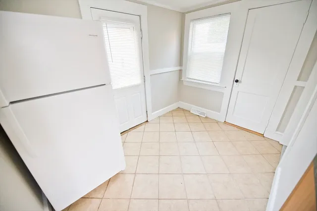 a bathroom with a toilet sink and shower